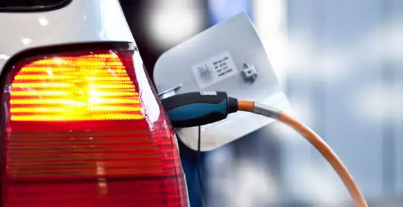 Electric car plugged into EV charger after professional installation in Charleston, SC