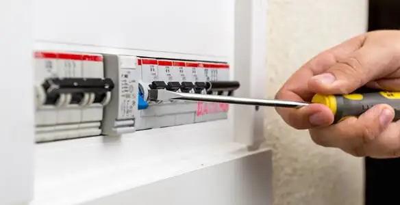 electrical panel upgrade service showing technician adjusting circuit breakers during system upgrade in Charleston, SC