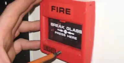fire alarm installation service showing manual fire alarm pull station installed by licensed electricians in Charleston, SC