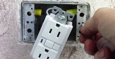 gfci circuits service showing installation of a ground fault circuit interrupter outlet by licensed electricians in Charleston, SC