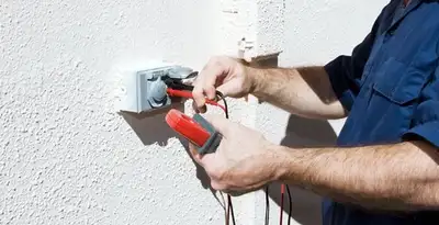 Electrician performing home electrical outlet and wiring inspection in Charleston, SC