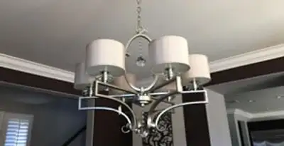 Modern chandelier installation with multiple light fixtures in Charleston, SC
