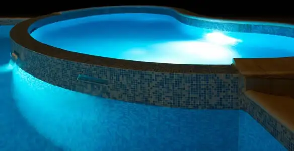 pool light installation and repair services highlighting illuminated pool interior lighting in Charleston, SC