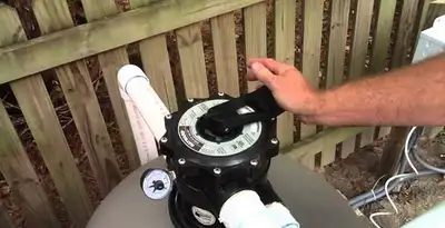 pool pumps service showing professional adjustment of pool pump control system in Charleston, SC