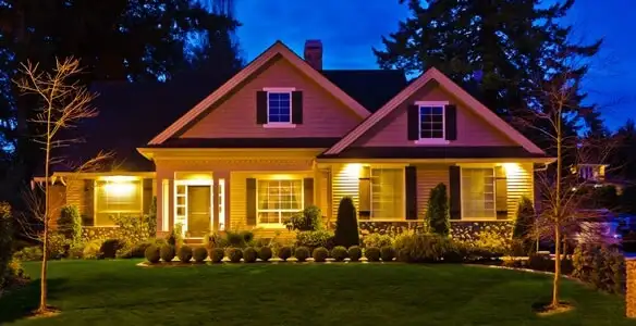 security light installation services illuminating a residential exterior at night in Charleston, SC