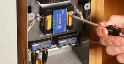 Whole home surge protection device being installed by a licensed electrician to protect electrical systems in Charleston, SC